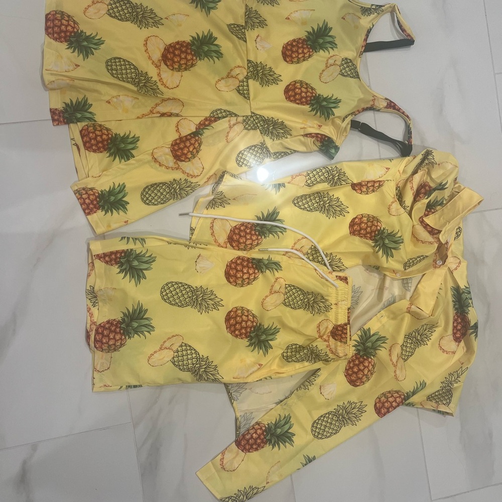 Men’s swimsuit and matching shirt and women’s bathing suit/skort. Never worn.
